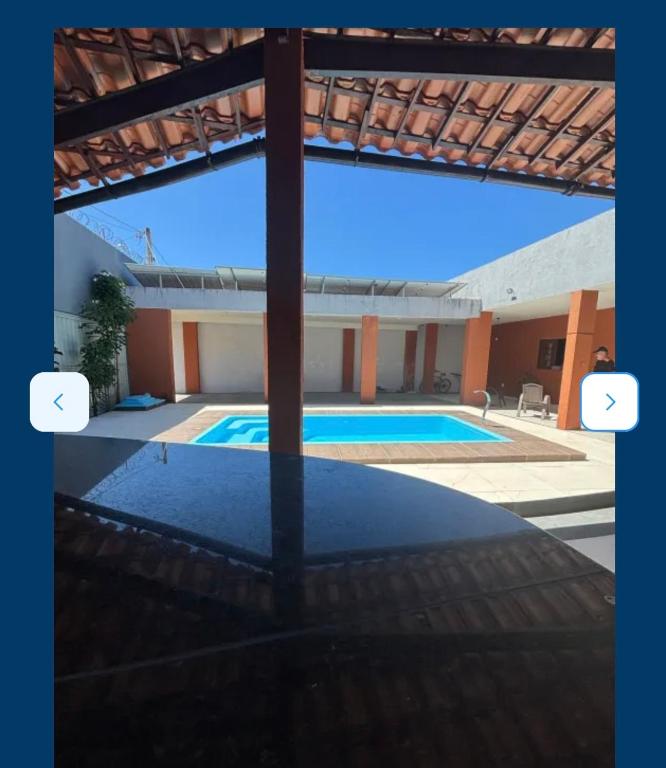 a view of a swimming pool in a house at casa sol e mar 01 in Paripueira