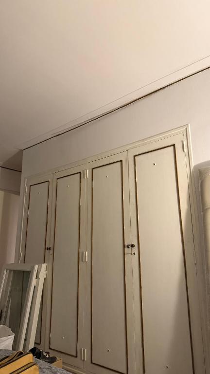 a row of wardrobes on a wall in a room at A pasos del Alto Vintge in Rosario