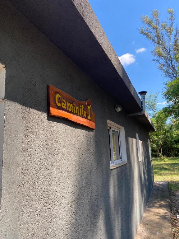 a sign on the side of a building at Caminito in Villa Anizacate