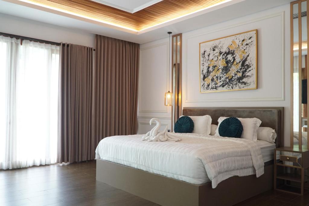 Кровать или кровати в номере Villa 4R Ungasan