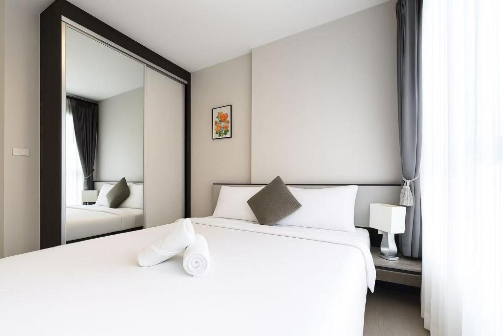 Postel nebo postele na pokoji v ubytování The Base酒店民宿预订 市中心 游泳池 健身房 海滩 度假屋 A-9F