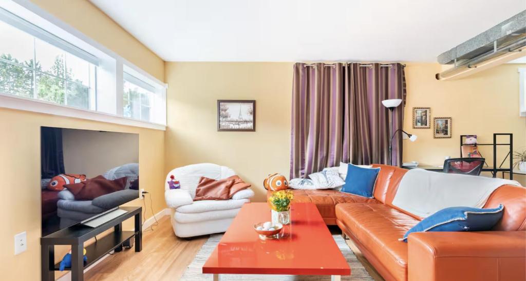 a living room with a couch and a table at Fresh Space Quiet Air Studio in Mercer Island