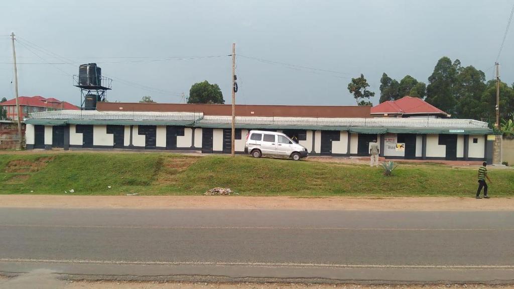a white van parked in front of a building at DADESA Pl in Kakamega