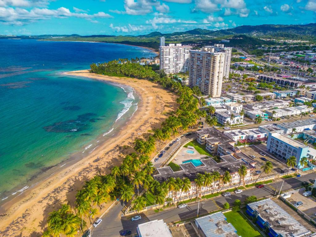 an aerial view of a beach and buildings at Beach Side House Amazing For Family and Group by PH in Luquillo