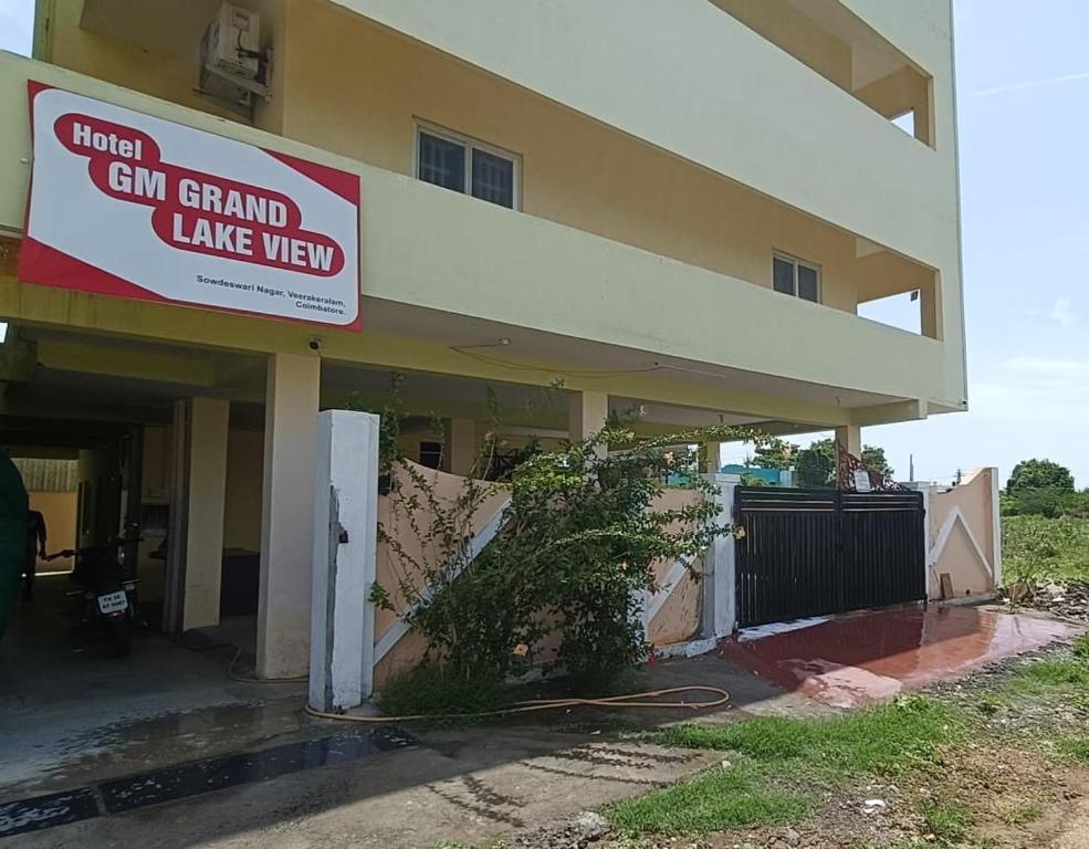a building with a sign that reads hotel gun grand lake view at GM nest in Coimbatore