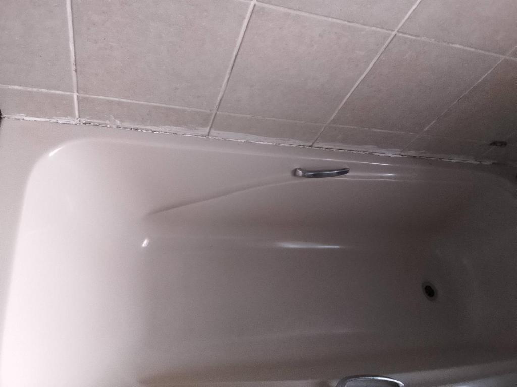 a white bath tub with a tiled ceiling at B vhonani in Polokwane