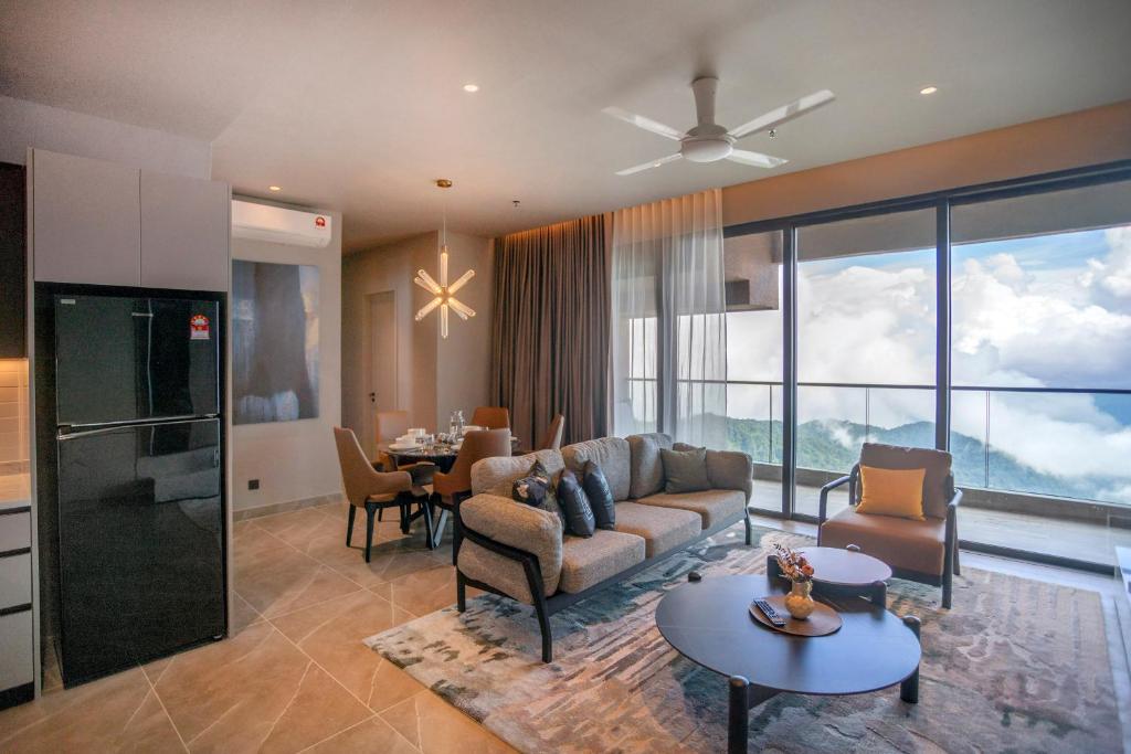 a living room with a couch and a table at Antara Genting Highlands by COBNB - near Link Bridge in Genting Highlands