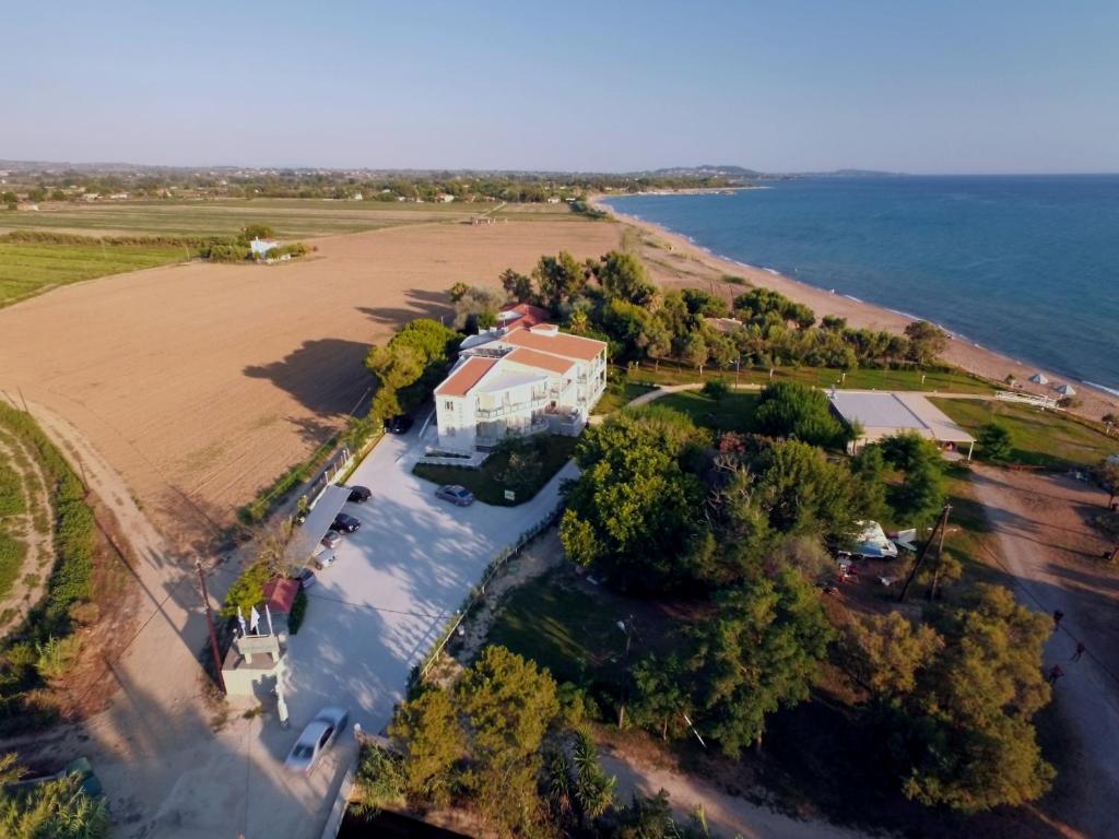 an aerial view of a house on the beach at Harmony Hotel in Kourouta