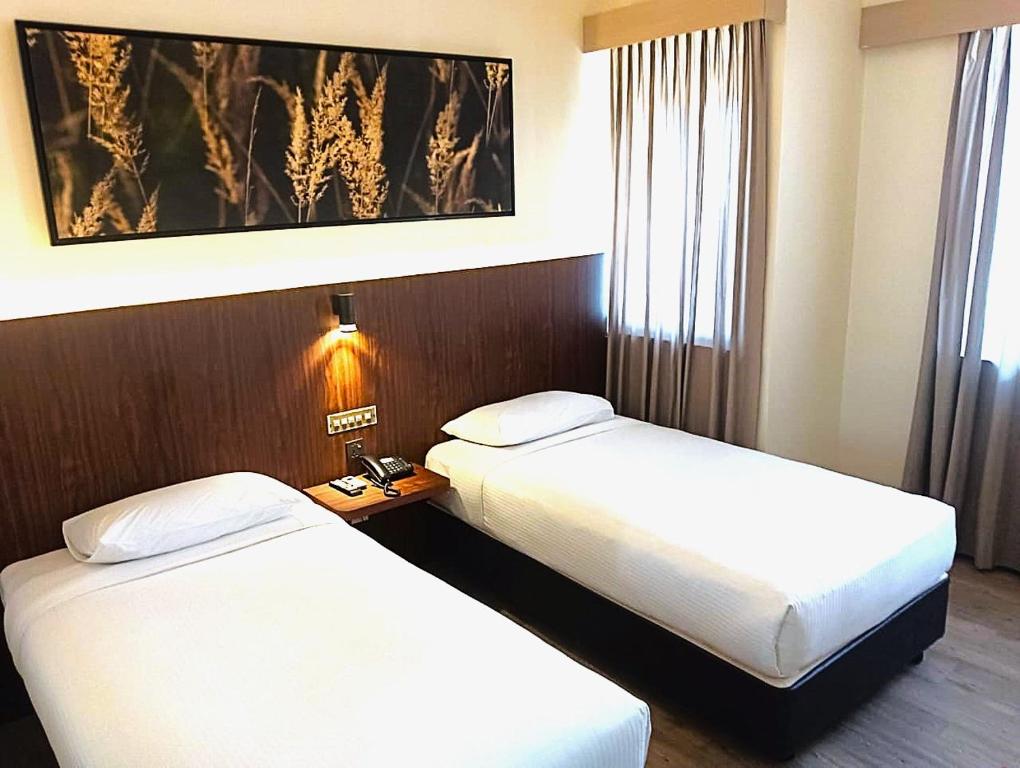 Ένα ή περισσότερα κρεβάτια σε δωμάτιο στο Good Hope Hotel