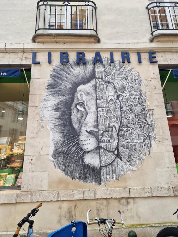 a mural of a lion on the side of a building at Apartmani Vila Marija in Budva