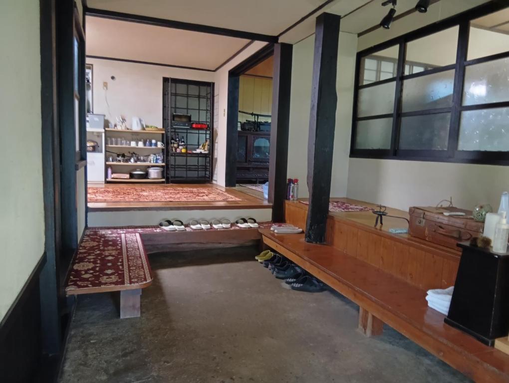 Ένα ή περισσότερα κρεβάτια σε δωμάτιο στο 横城ゲストハウス 自然豊かなプライベート空間 古民家一棟貸しの宿