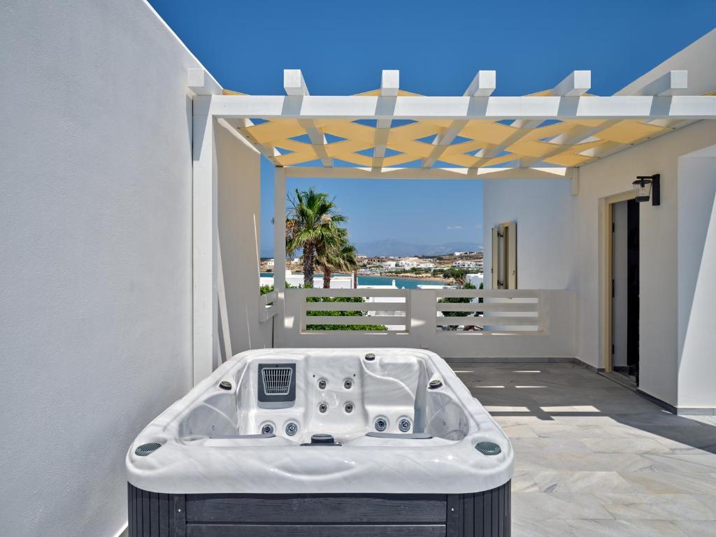 a bath tub sitting in the middle of a house at Villa Maria Naoussa in Naousa