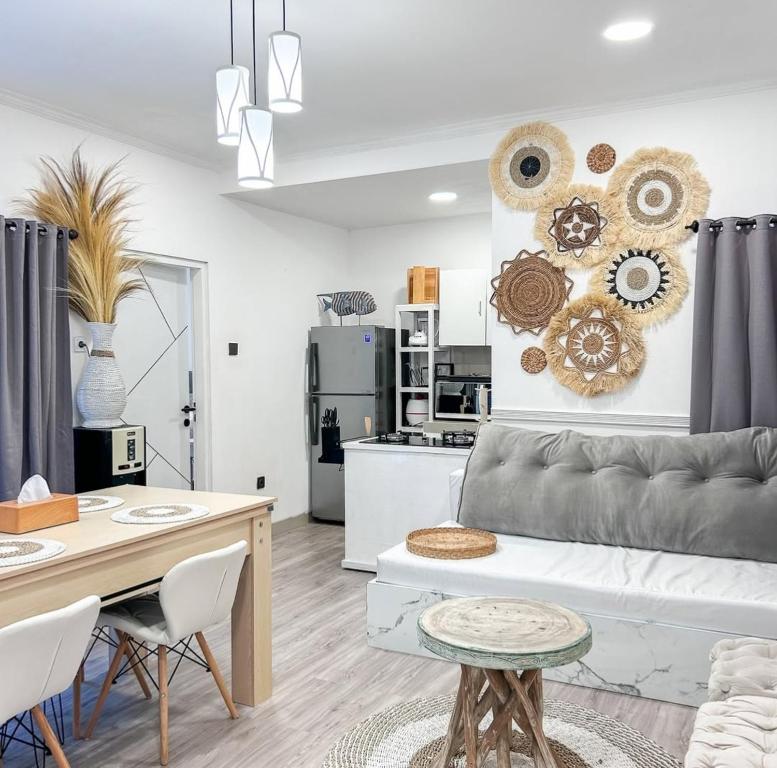 a living room with a couch and a table at Atropa belladonna in Sembalun Lawang