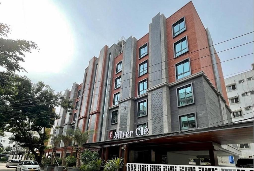 a building with a sign on the front of it at Hotel Silver Cle Hitech City Madhapur in Hyderabad