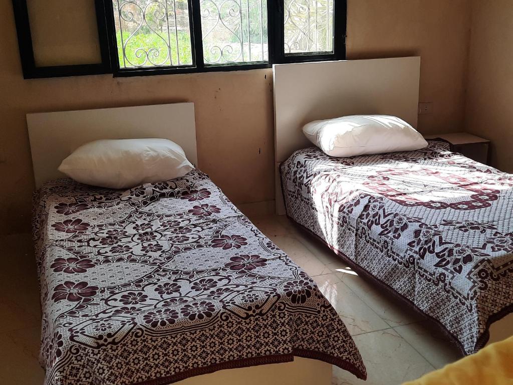 Ένα ή περισσότερα κρεβάτια σε δωμάτιο στο استراحة الباشا albash farm stay