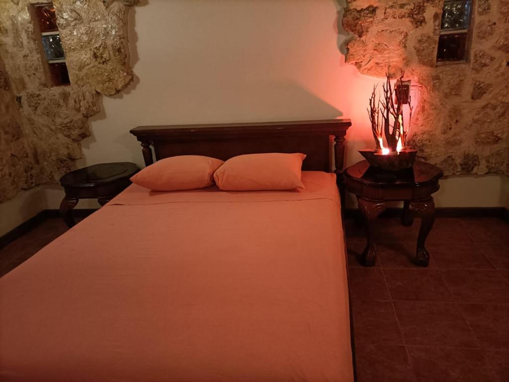 Een bed of bedden in een kamer bij Casa Mango