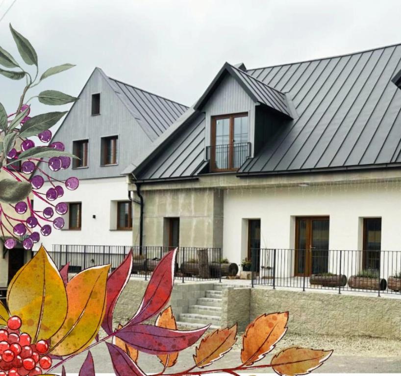 a house with a painting on the side of it at Penzion Branná in Branná