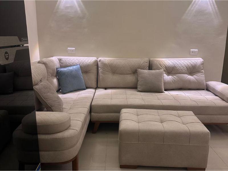 a living room with a large couch and a chair at Alma & Thiago House in Sharm El Sheikh