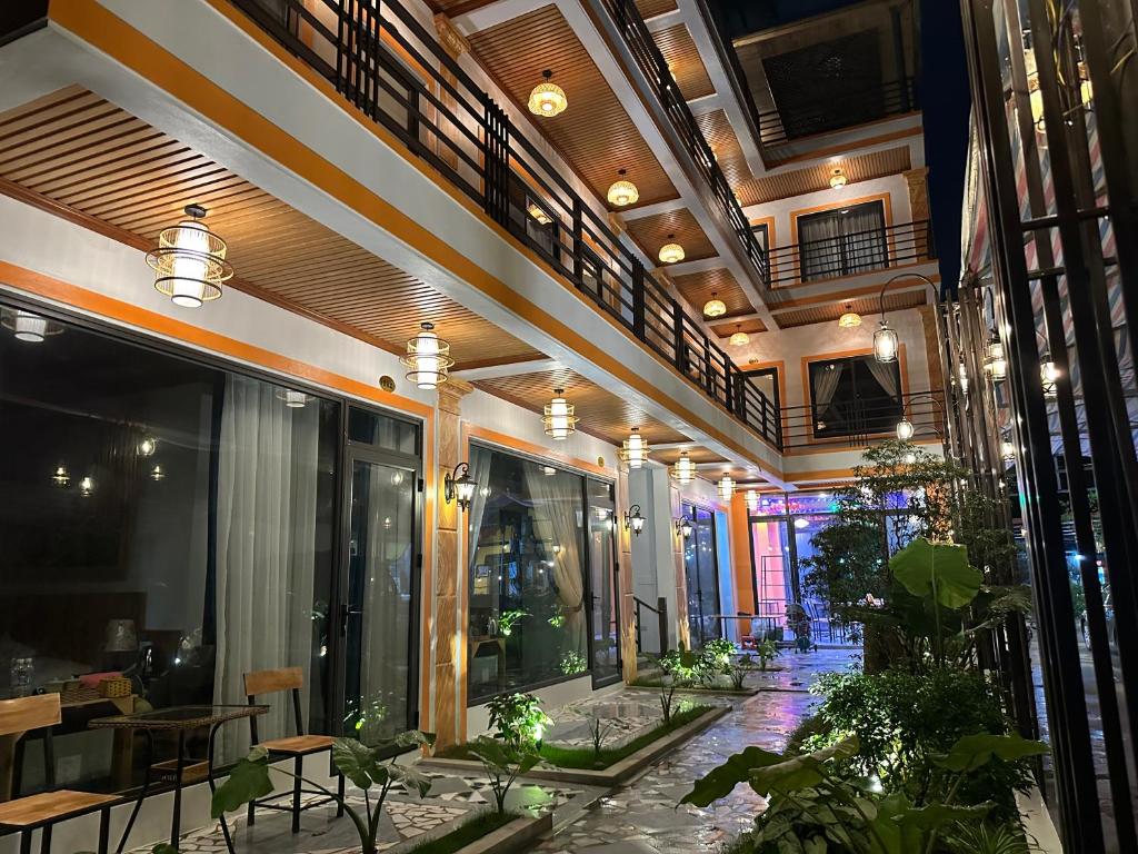 a building with a patio with plants in it at Tam Coc Vinh Thinh Homestay in Ninh Binh