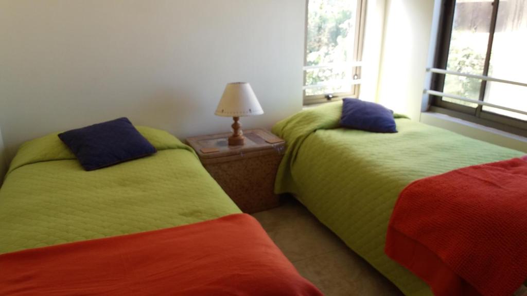 Postel nebo postele na pokoji v ubytování Maitencillo Opas Apartment