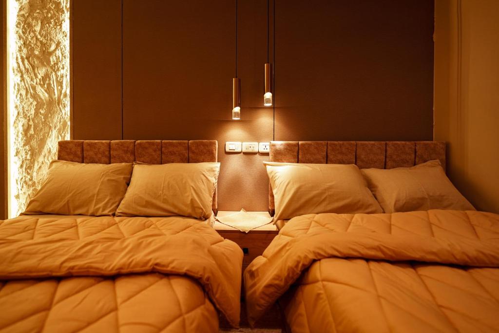 Ένα ή περισσότερα κρεβάτια σε δωμάτιο στο Sydney Downtown Cairo Hotel