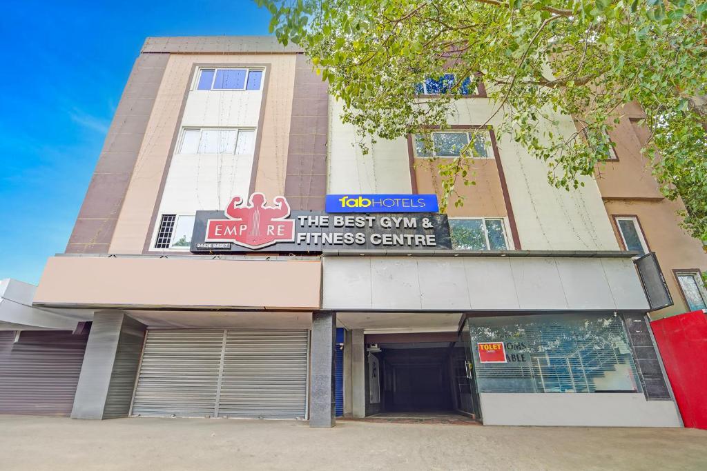 Un edificio con un cartel en el frente. en Via AB Top, en Coimbatore