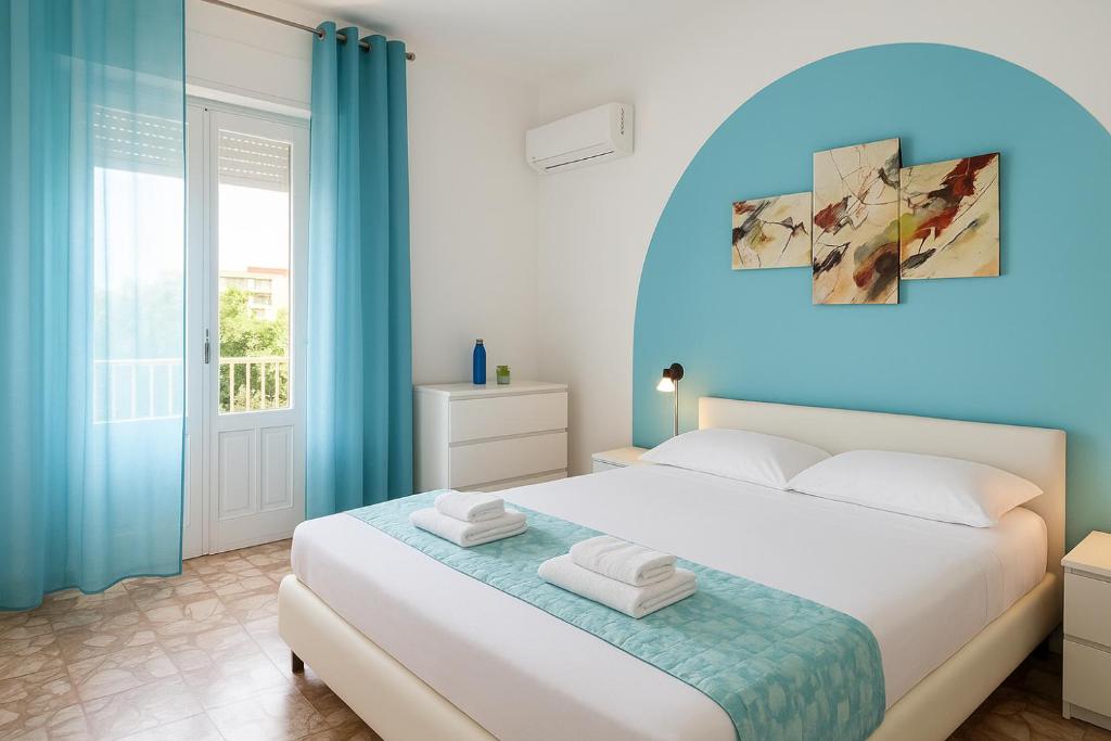 Postel nebo postele na pokoji v ubytování Gardenia Rooms