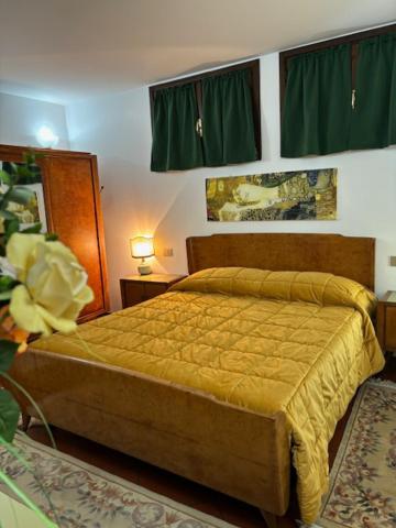 Postel nebo postele na pokoji v ubytování VILLA ISELLA