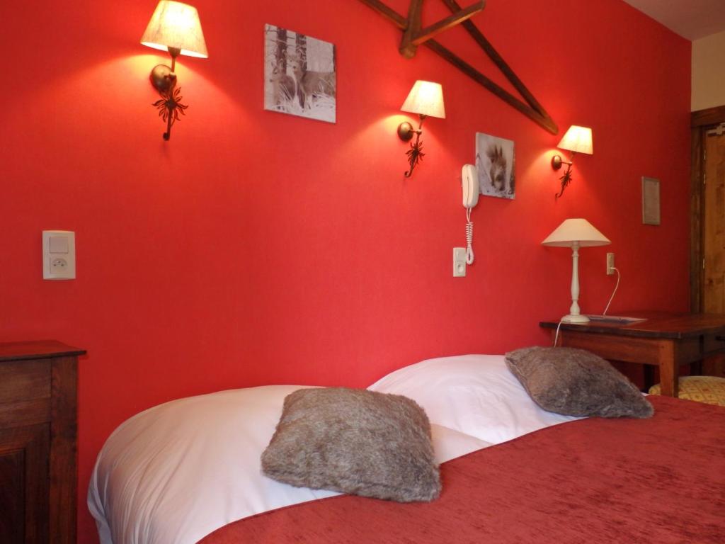 Postel nebo postele na pokoji v ubytování Hôtel Viallet