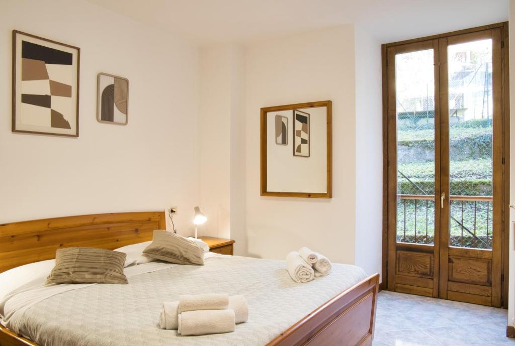 Una cama o camas en una habitación de Lòbia Parrocchiale