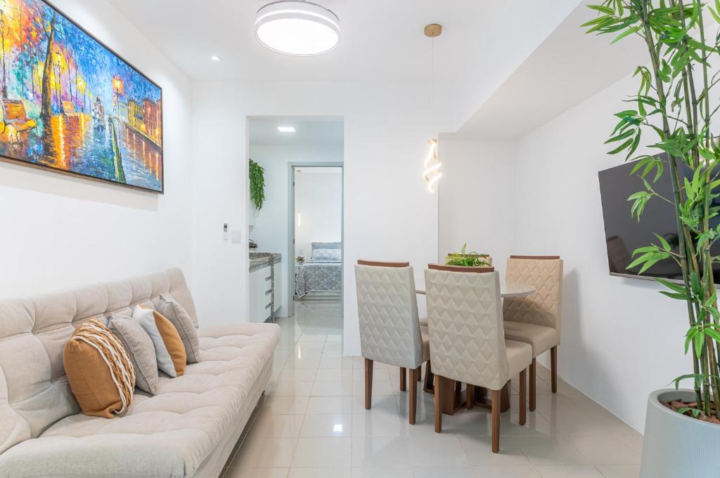 a living room with a couch and a table at Place Beira Mar in Recife