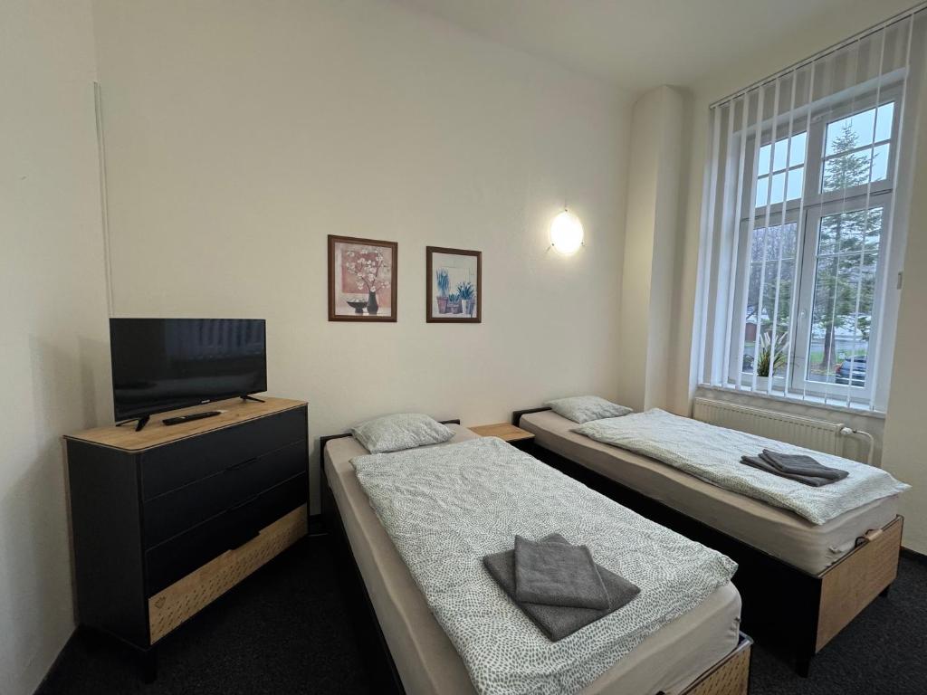 Postel nebo postele na pokoji v ubytování Penzion Zahrada Čech