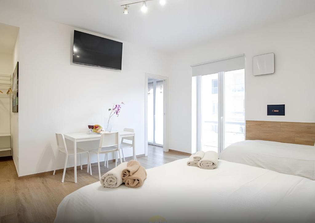 Ένα ή περισσότερα κρεβάτια σε δωμάτιο στο Platinum - Il Centro Luxury Suites