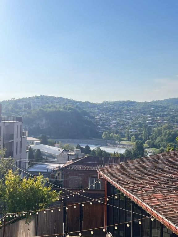 a view of a city from the roof of a building at Comfortable House the city centr in Kutaisi