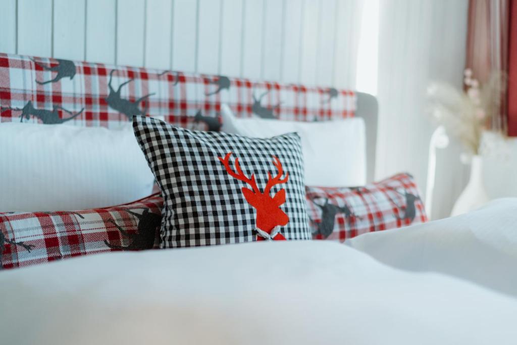 En eller flere senge i et værelse på Apartment Enzian