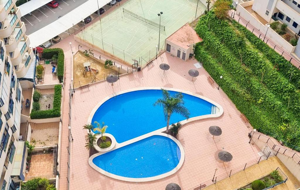 an overhead view of a swimming pool in a building at Nice Apartment In Villajoyosa With Swimming Pool in Cala de Finestrat