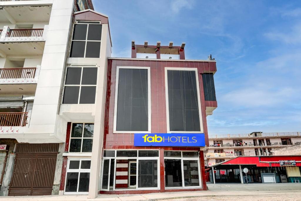 a building with a toto tots sign on it at FabHotel Vrishti Residency in Greater Noida