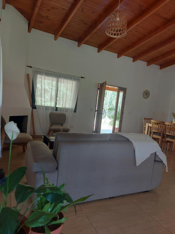a living room with a couch and a chair at Casa El Eucaliptal in Puerto Rico
