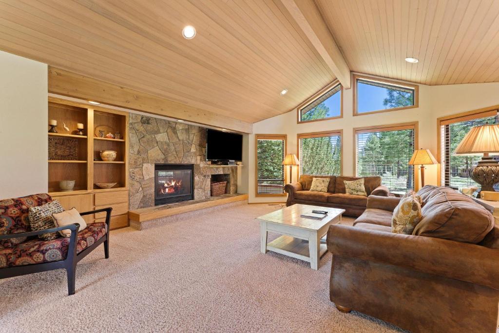 a living room with a couch and a fireplace at 10 Tan Oak in Sunriver