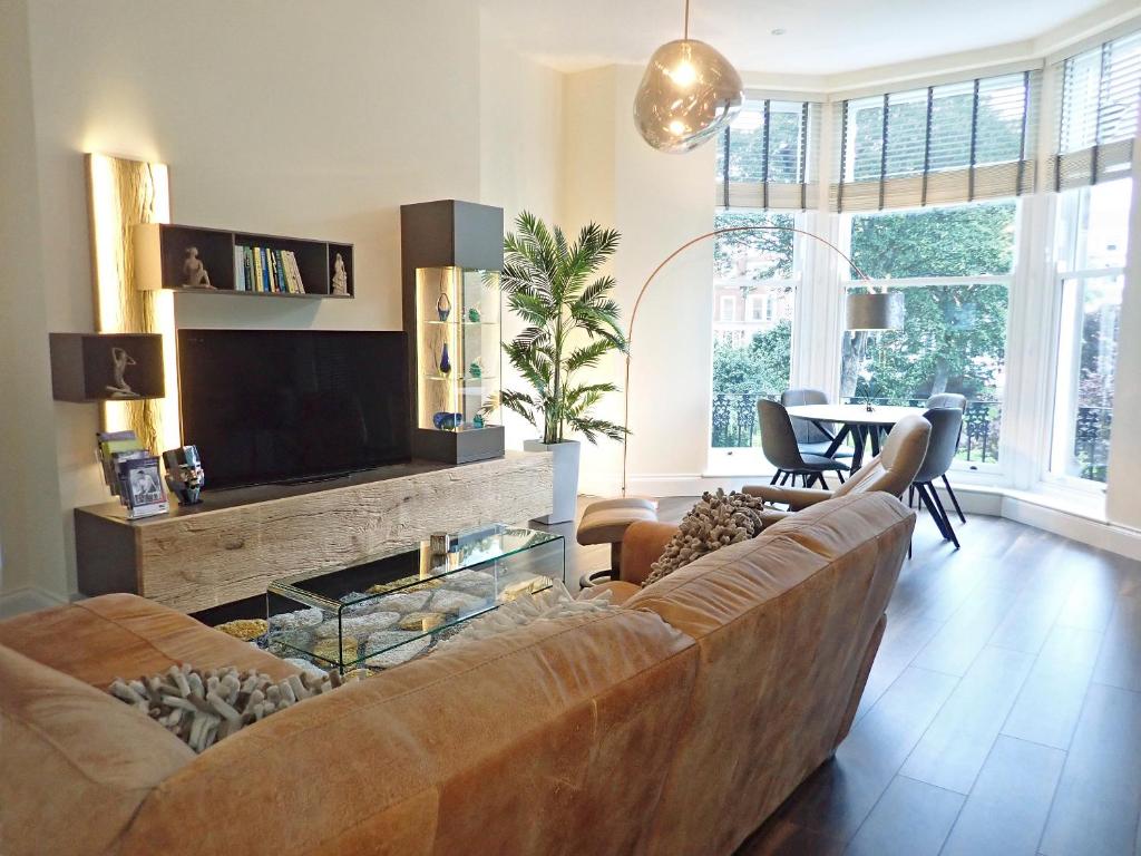 a living room with a couch and a television at The Haven in Scarborough