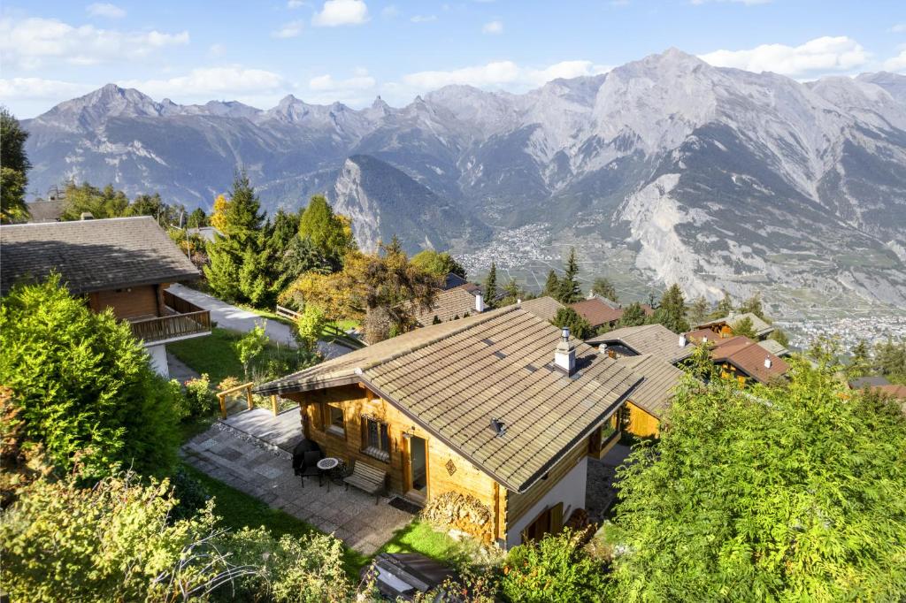 an aerial view of a house with mountains in the background at Silverfox - 6 pers - belle vue in Plan Fey