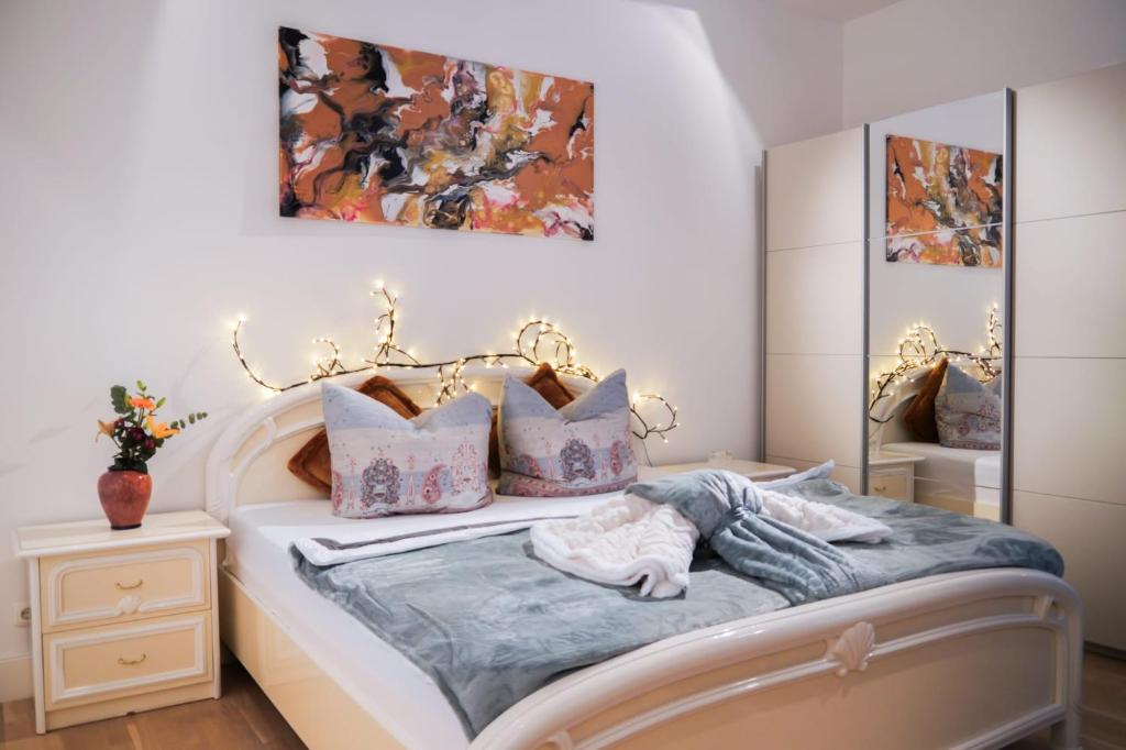 Postel nebo postele na pokoji v ubytování Villa Greve Galerie-Apartment