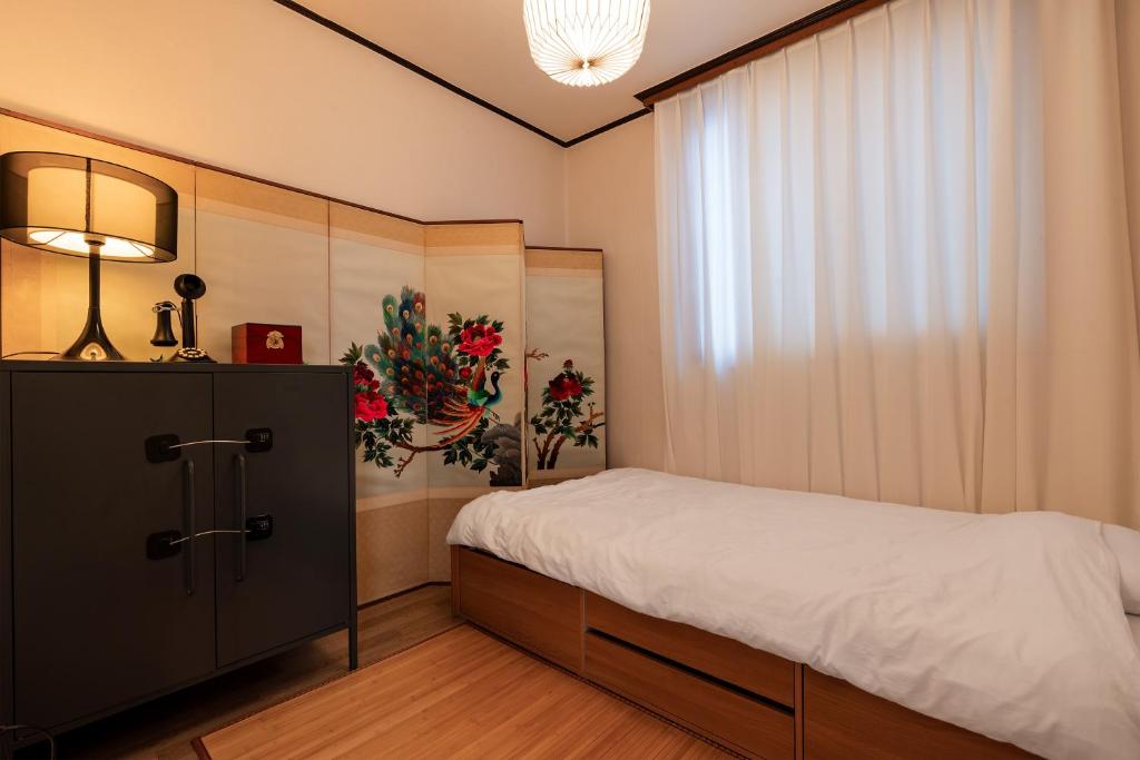 Postel nebo postele na pokoji v ubytování Timeless Hanok In Jamsil Serenity