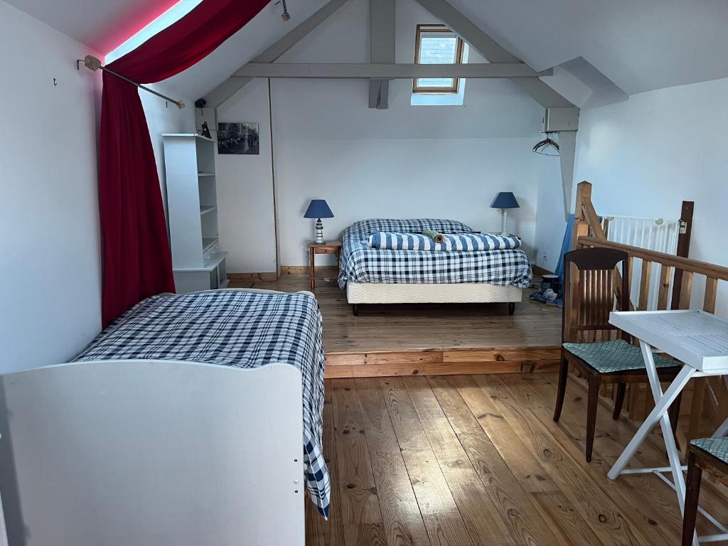 Postel nebo postele na pokoji v ubytování La cabane du pêcheur