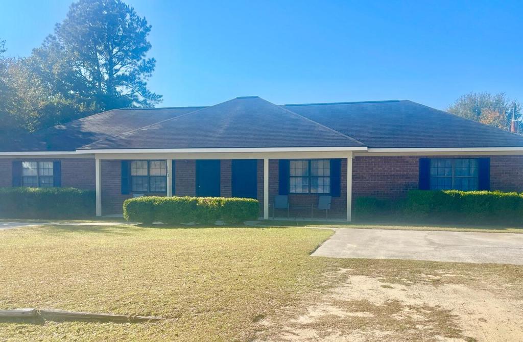 a house with a large yard in front of it at Simply Home in Statesboro