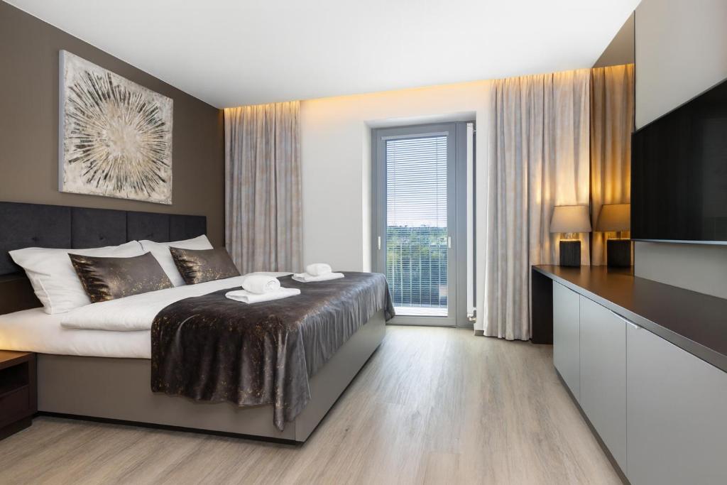 Ένα ή περισσότερα κρεβάτια σε δωμάτιο στο Hotel Awam