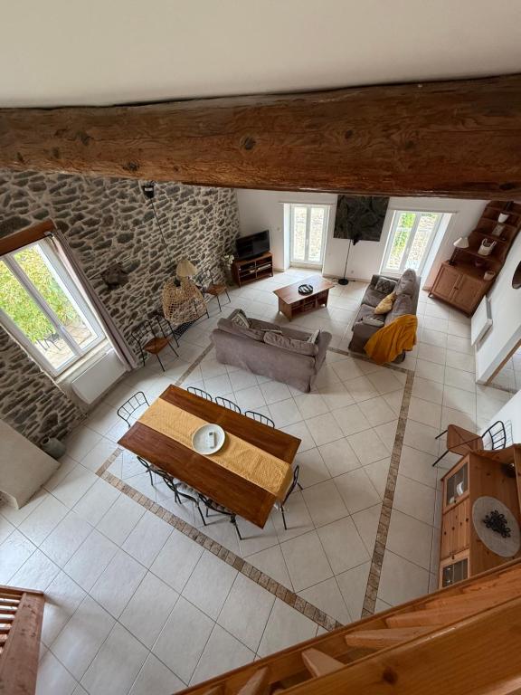 an overhead view of a living room with a table at Gîte au cœur d un caveau de dégustation de vin in Olonzac
