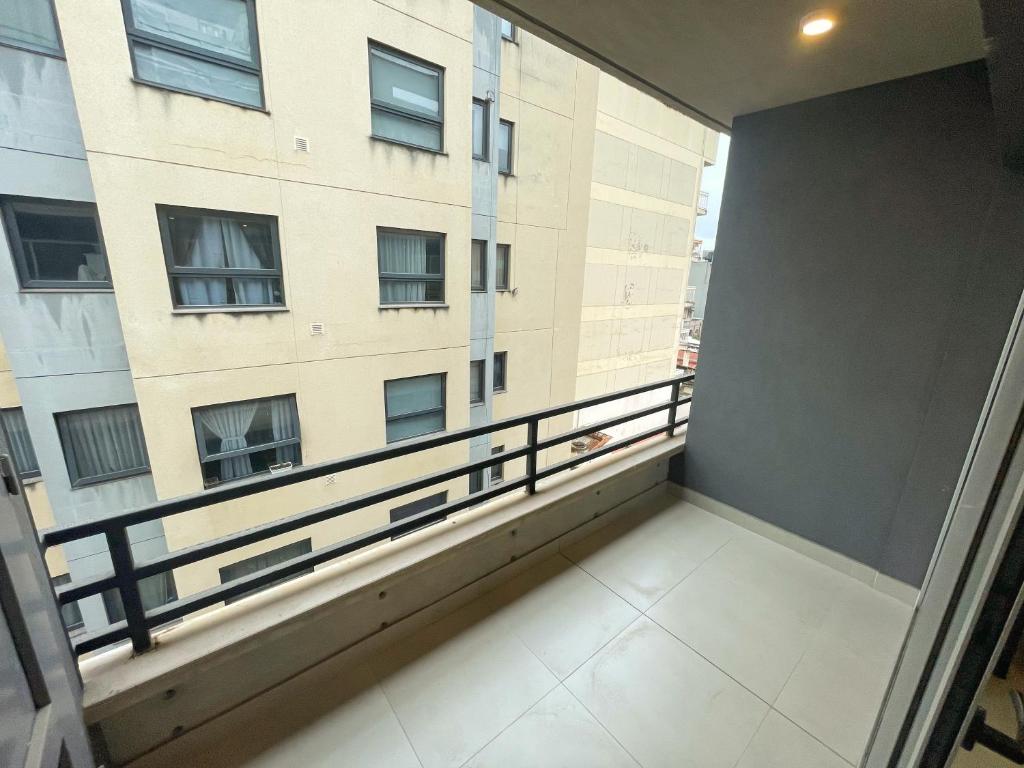 an empty balcony in a building with a window at Otero Coliving - Studio Entero U8 in San Salvador de Jujuy