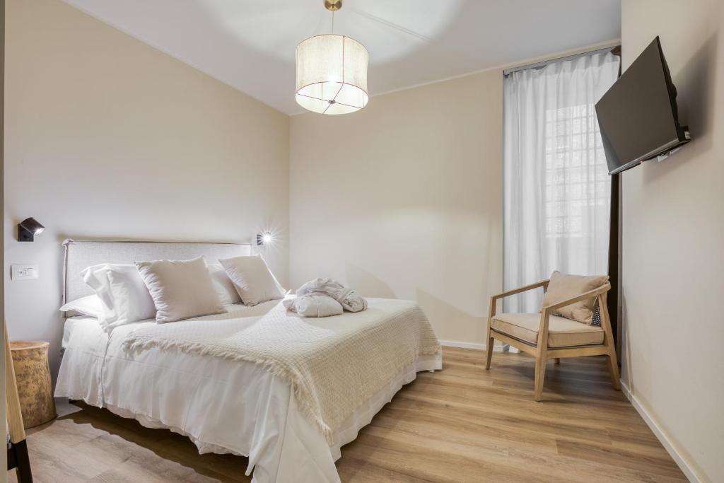 Postel nebo postele na pokoji v ubytování Wellness Suites