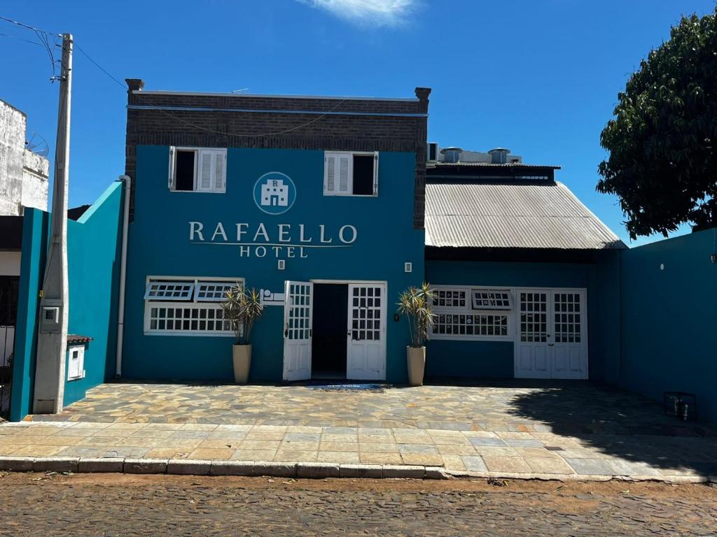 a blue building with the words rafalula hotel at RAFAELLO HOTEL in São Borja